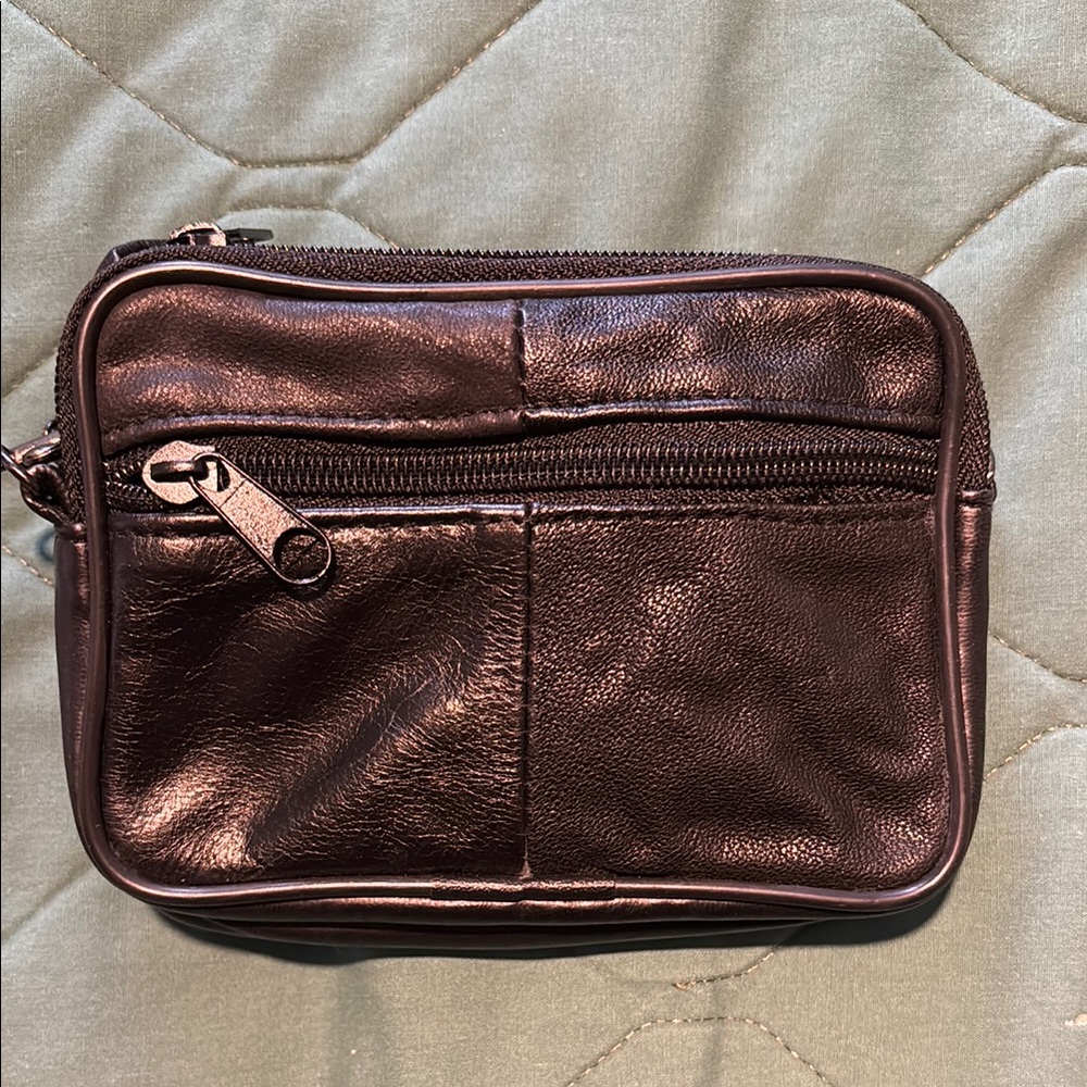 Women’s or Men’s shoulder/ belt bag. Black pleather with 3 zip pockets.